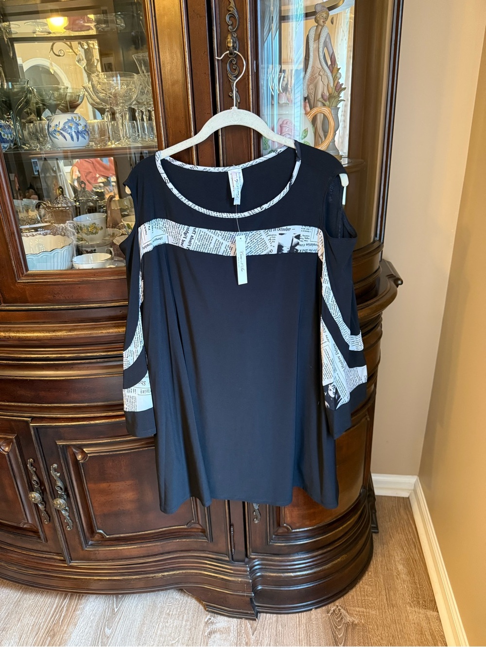 Cold-Shoulder Black Top with Newspaper Print Trim